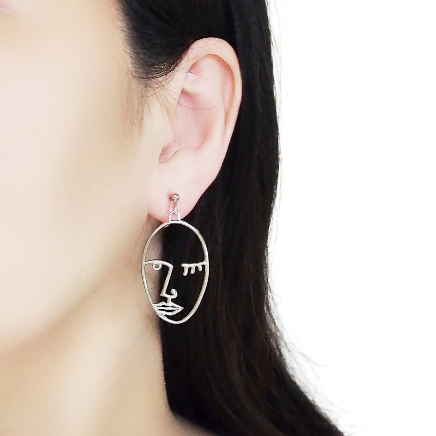 Silver Picasso Face Wink Invisible Clip On Earrings