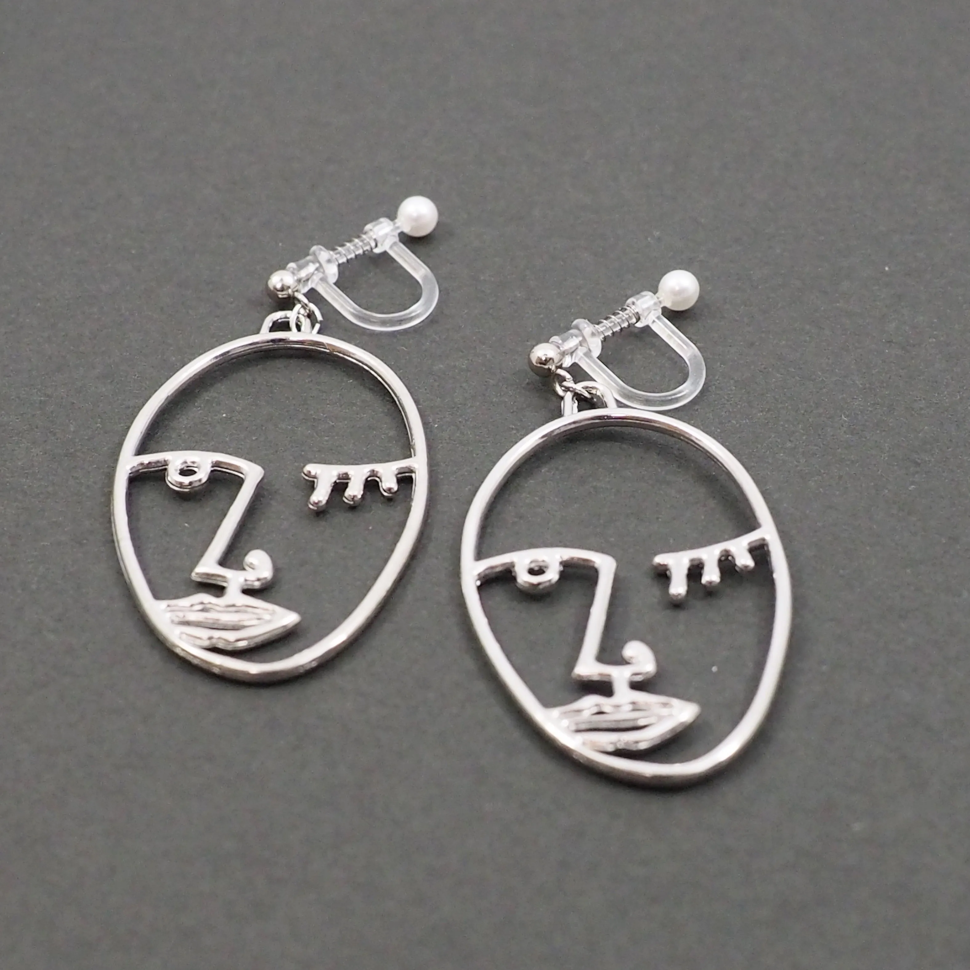 Silver Picasso Face Wink Invisible Clip On Earrings