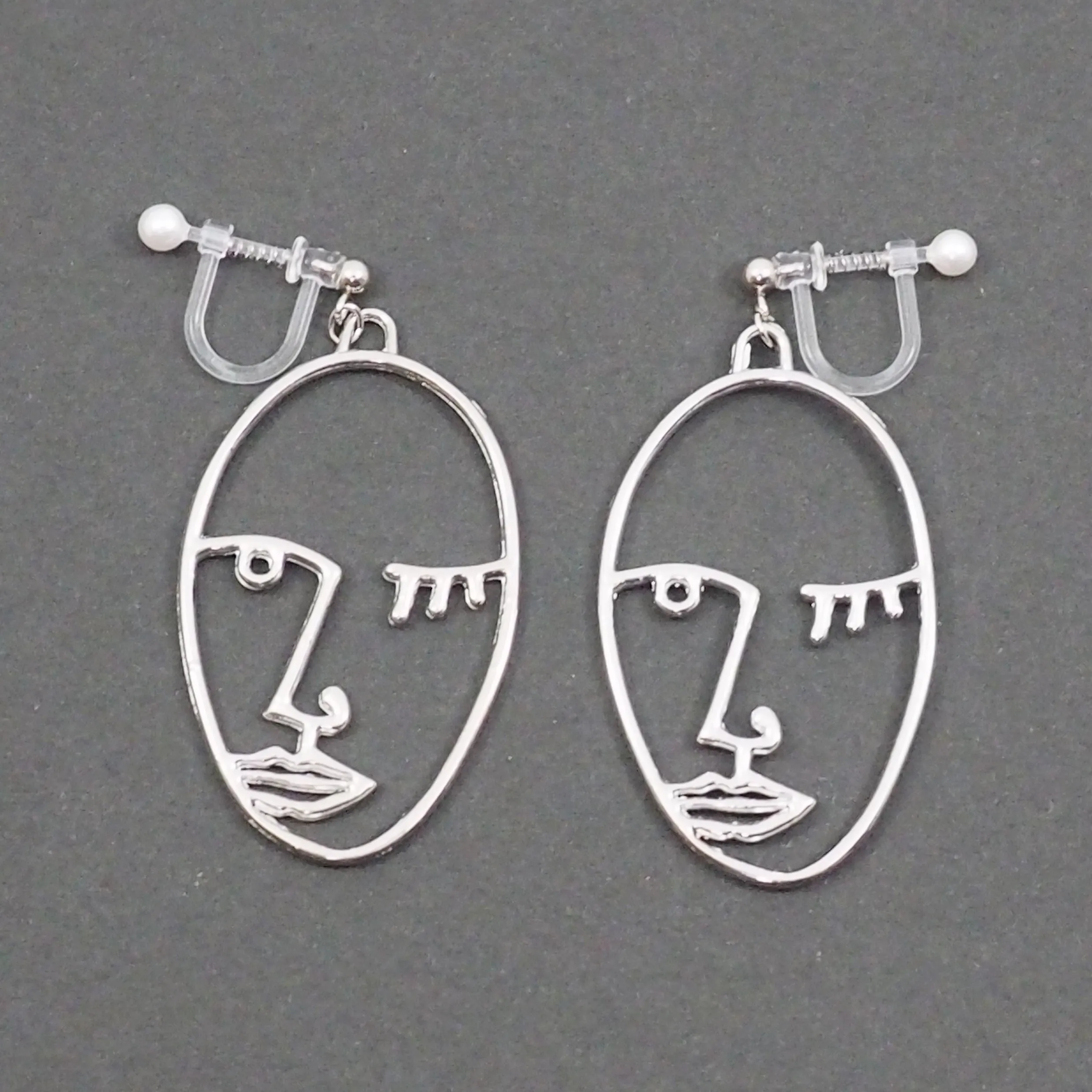 Silver Picasso Face Wink Invisible Clip On Earrings